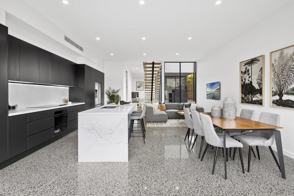polished concrete flooring in luxurious house featuring granite bench beautiful chairs and table